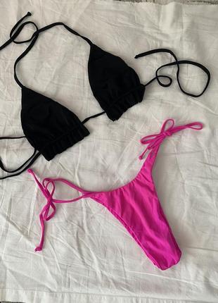 Купальник чорних верх рожевий низ