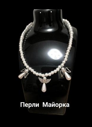 Ожерелье-чокер с майоркой и декором "ангелы"