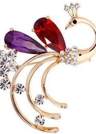 Золотиста брошка з павичем