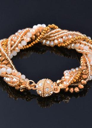 Багатошаровий браслет золотисто - коричньового кольору довжина 19 см