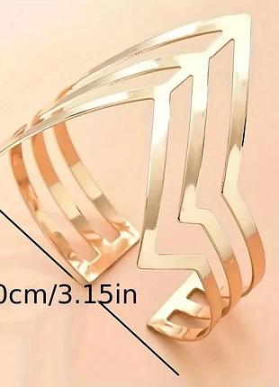 Золотистий браслет на верхню частину руки