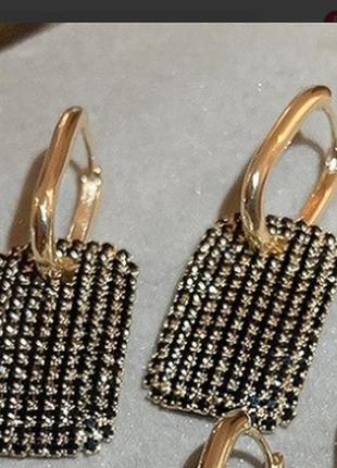 Золотисті елегатні сережки з цирконом