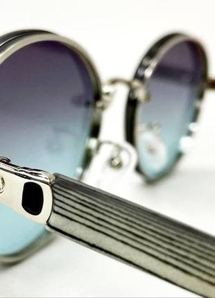 Очки солнцезащитные женские круглые безоправные с серо-голубой линзой тоненькие пластиковые дужки3 фото