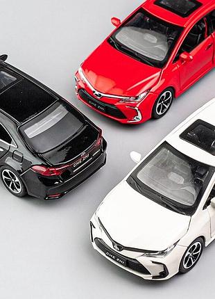 Модель автомобиля toyota corolla масштаб: 1:32. игрушечная машинка тойота королла белая (звук, свет). 9