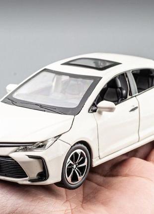 Модель автомобиля toyota corolla масштаб: 1:32. игрушечная машинка тойота королла белая (звук, свет). 4