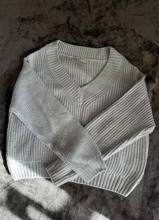 Вʼязаний кардиган блакитного кольору