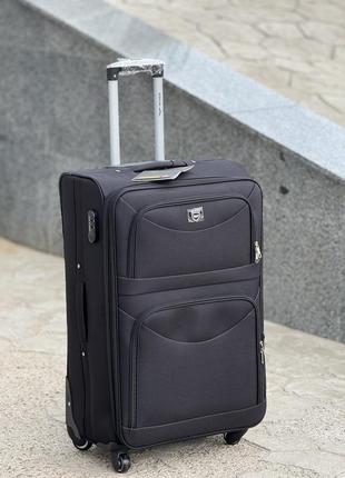 Велика валіза дорожня тканинна l польща на колесах wings з підшипником6 фото