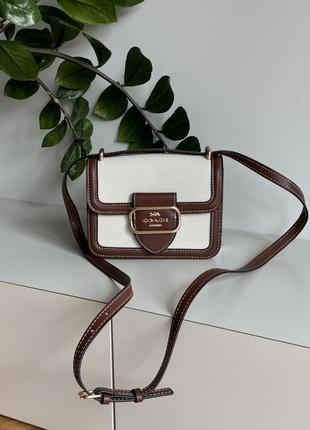 Сумка coach з текстилю та гладкої шкіри.