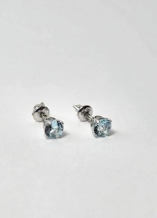 Серебряные серьги гвоздики на закрутках с голубым камнем 5 мм серебро 925 пробы родированное 72236г 1.01г