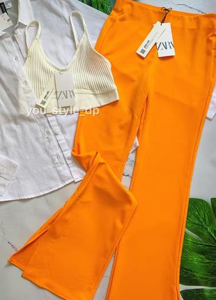 Жіночі помаранчеві брюки з розрізом зара zara 7901/1671 фото