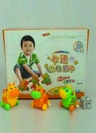 Іграшка заводна корівка на коліщаткаx ie446  (упаковка)