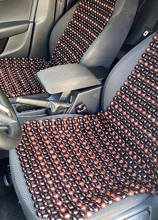 Дерев'яна автомасажна накидка на сидіння автомобіля.