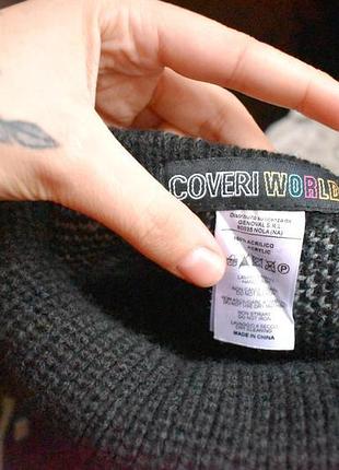 Красивое вязаное черно-серое пончо