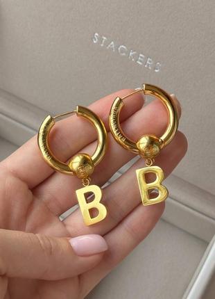 Сережки в стилі balenciaga