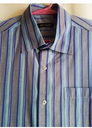 Рубашка мужская с коротким рукавом. расцветка полоска серо-голубая. 
б/у в очень хорошем состоянии1 фото