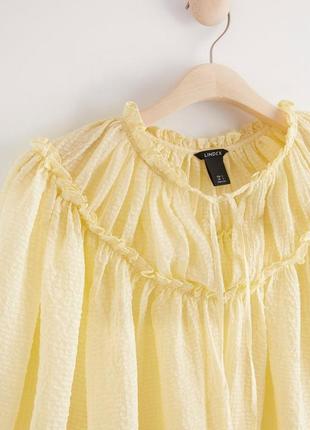 Шикарная желтая блузка с пышными рукавами3 фото