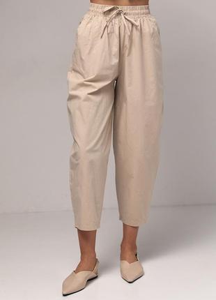 Жіночі штани-банани з кишенями — бежевий колір, m (є розміри)1 фото