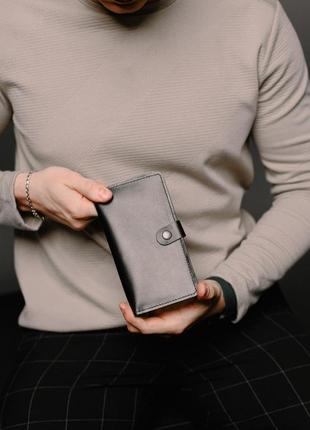 Мужской черный портмоне, кошелек из натуральной гладкой кожи на кнопке.2 фото