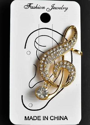 Золотиста та срібляста сережка кафф у вигляді скріпічного ключа