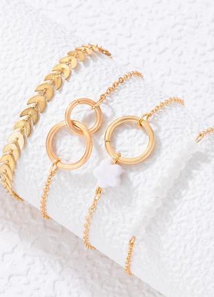 Комплект з 4 золотистих браслетів