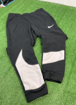 Спортивні штани nike training dri-fit energy swoosh7 фото