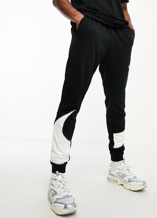 Спортивні штани nike training dri-fit energy swoosh1 фото