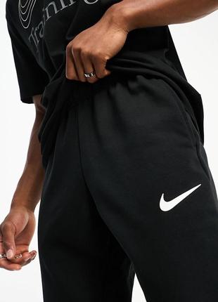 Спортивні штани nike training dri-fit energy swoosh4 фото