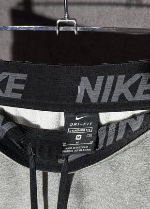 Мужские спортивные штаны nike dri-fit tapered m3 фото