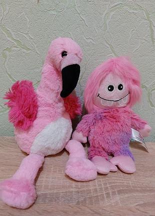 Розовые игрушки фламинго и чудик