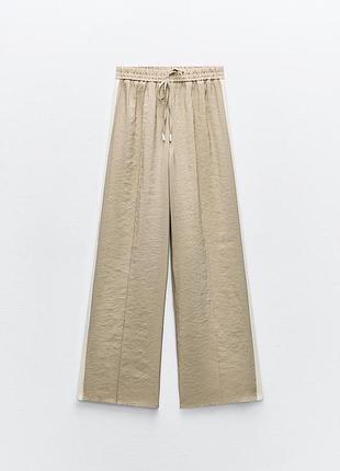 Очень красивые штанишки zara с лампасами. состав ткани модал.