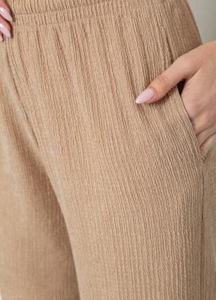 Стильні широкі жіночі штани палаццо штани-палаццо бежеві жіночі штани широкого крою штани у рубчик5 фото