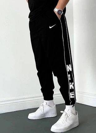 Чоловічі спортивні вінтажні штани з плащівки nike