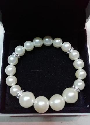 Оригинальный эластичный браслет с перлами и стразами1 фото