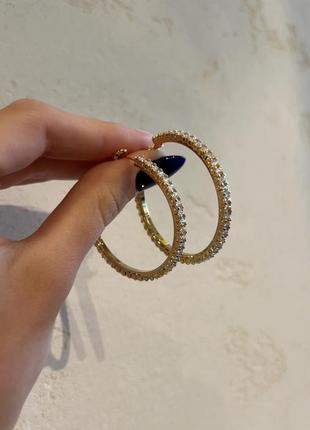 Брендовые серьги, кольца в позолоте с цирконами1 фото