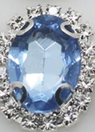 Камень в серебристой оправе 2*1,5 см светло-синий1 фото
