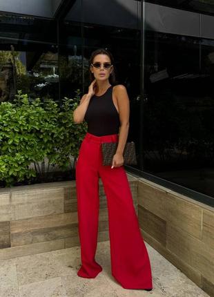 Брюки свободного кроя на пуговице и молнии