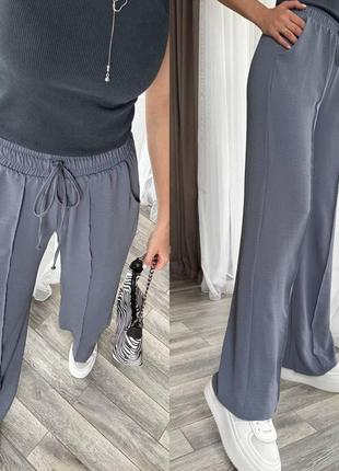 Свободные женские брюки из жатки на лето серые (размеры 42, 44, 46, 48, 50, 52)6 фото