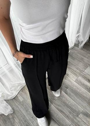 Свободные женские брюки из жатки на лето черные (размеры 42, 44, 46, 48, 50, 52)4 фото