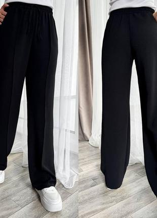 Свободные женские брюки из жатки на лето черные (размеры 42, 44, 46, 48, 50, 52)5 фото