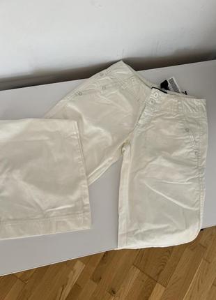 Білі жіночі брюки палаццо джинси штани