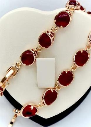 Браслет с красными кристаллами xuping m&amp;l (медицинское золото) длина 17-19 см. ширина 8 мм.