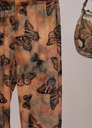 Невероятные прозрачные брюки клеш в бабочки urban outfitters6 фото