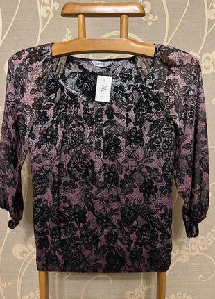 Очень красивая и стильная брендовая блузка в цветах.7 фото