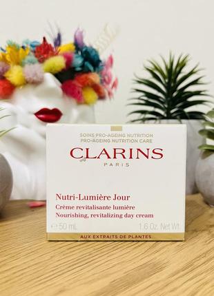 Оригінал денний омолоджувальний крем clarins nutri-lumière day cream