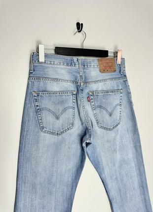 Levi’s 507 00 винтажные джинсы из голубого денима имеют фабричные потертости + клешевые штанины.3 фото