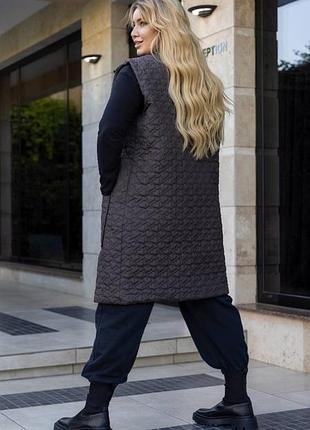 Жіноча осіння подовжена жилетка