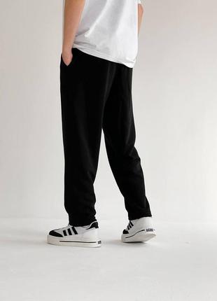 Чоловічі якісні зручні чорні спортивні широкі штани2 фото