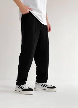 Чоловічі якісні зручні чорні спортивні широкі штани1 фото