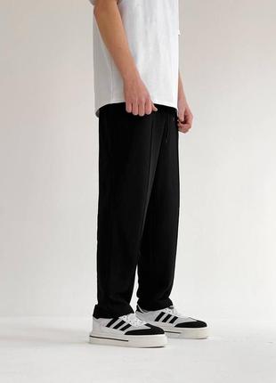 Мужские качественные удобные черные спортивные широкие брюки3 фото