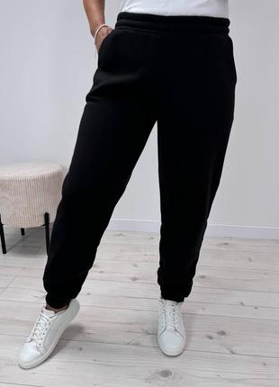 Спортивні штани на флісі на високій посадці з кишенями з манжетами з низу